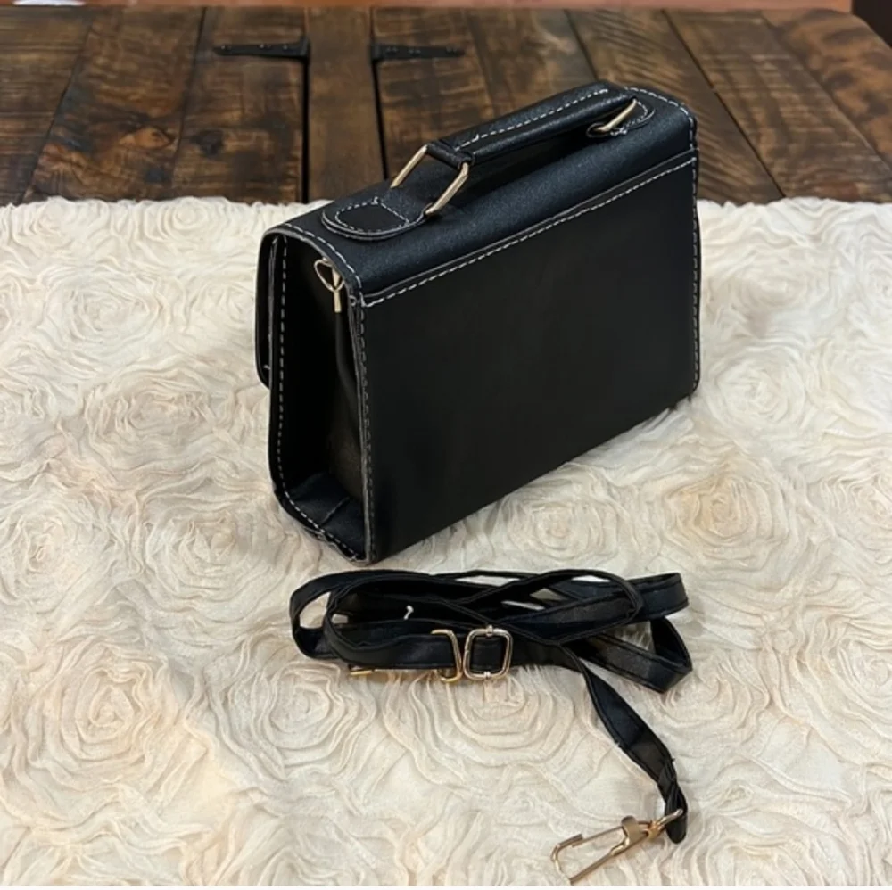 Elegant Black and White Crossbody Bag with Bee Detail